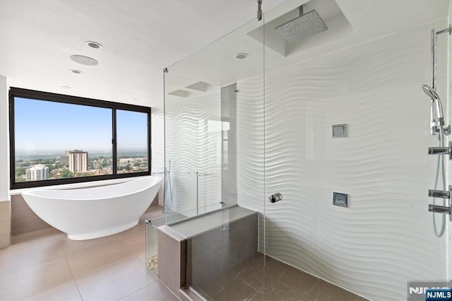 200 Old Palisade Unit Ph4/5, Fort Lee, NJ 07024 - bathroom with tile patterned flooring, a shower stall, and a soaking tub