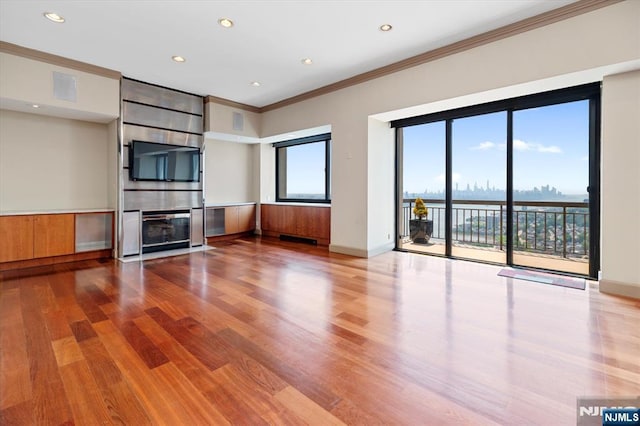 200 Old Palisade Unit Ph4/5, Fort Lee, NJ 07024 - unfurnished living room with ornamental molding, a fireplace, wood finished floors, and recessed lighting