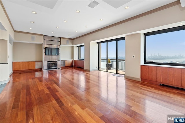 200 Old Palisade Unit Ph4/5, Fort Lee, NJ 07024 - unfurnished living room featuring crown molding, light wood-style flooring, a large fireplace, and recessed lighting