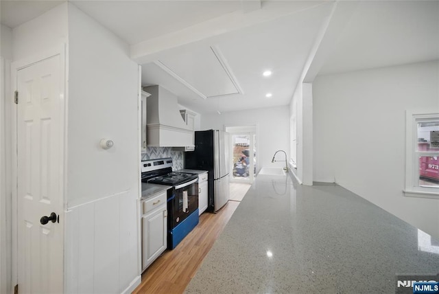 9 S Reilly Rd, Jefferson Township, NJ 07438 - kitchen featuring range with electric cooktop, custom exhaust hood, decorative backsplash, light stone countertops, and white cabinetry
