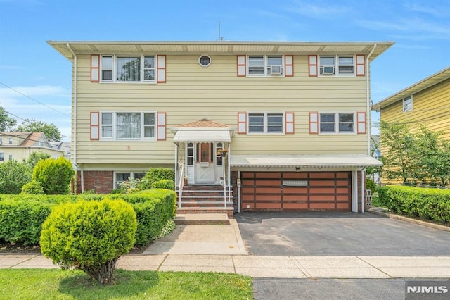 15 Jersey St, East Rutherford, NJ 07073 - view of front of home with an attached garage and asphalt driveway