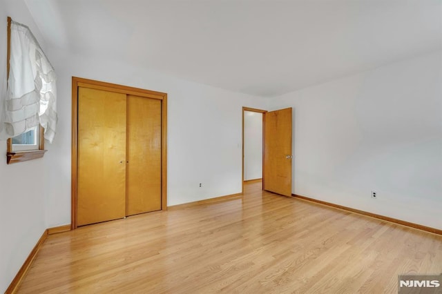 15 Jersey St, East Rutherford, NJ 07073 - unfurnished bedroom with light wood-style flooring and a closet