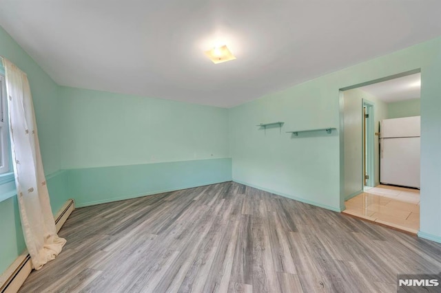 15 Jersey St, East Rutherford, NJ 07073 - empty room featuring baseboard heating and wood finished floors