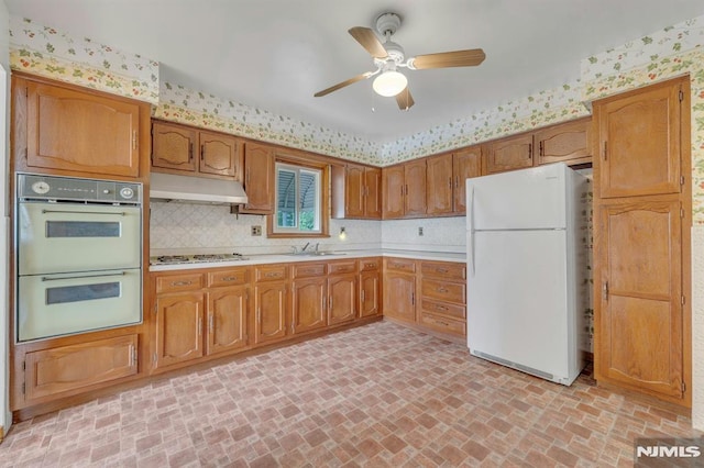 15 Jersey St, East Rutherford, NJ 07073 - kitchen featuring white appliances, under cabinet range hood, light countertops, brick patterned flooring, and ceiling fan