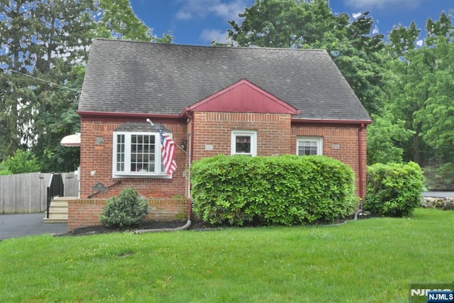 62 Overlook Ave, North Haledon, NJ 07508 - view of front of property featuring brick siding, a shingled roof, and board and batten siding