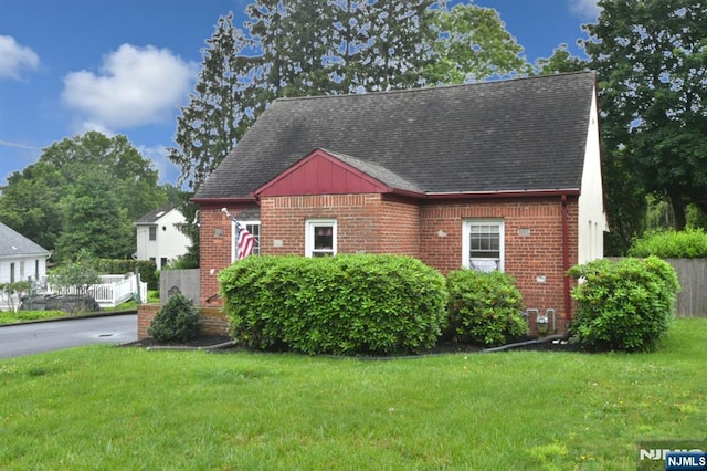62 Overlook Ave, North Haledon, NJ 07508 - view of front of home featuring brick siding, a front lawn, and roof with shingles