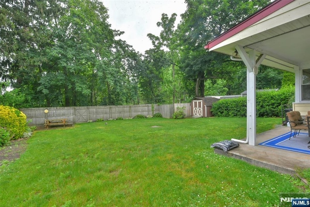 62 Overlook Ave, North Haledon, NJ 07508 - fenced backyard with a storage unit and a patio area