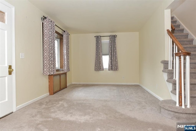 62 Overlook Ave, North Haledon, NJ 07508 - spare room with stairs, carpet floors, and healthy amount of natural light