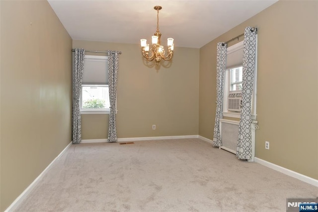 62 Overlook Ave, North Haledon, NJ 07508 - empty room with a chandelier and carpet floors
