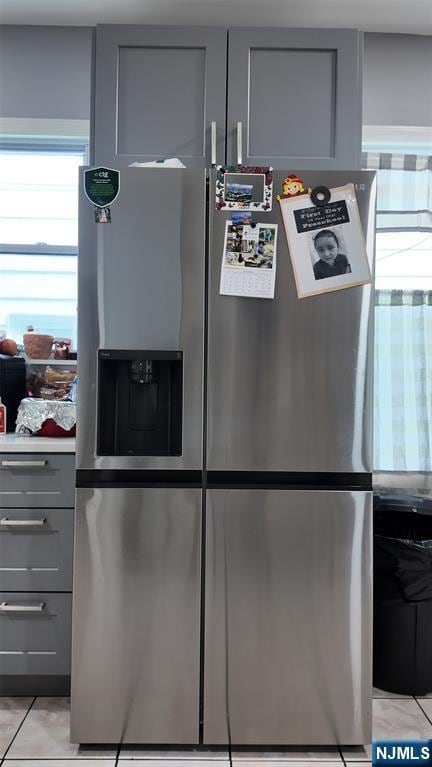 20 2nd Ave, Paterson, NJ 07524 - kitchen view of gray cabinets, stainless steel refrigerator with ice dispenser, and light countertops