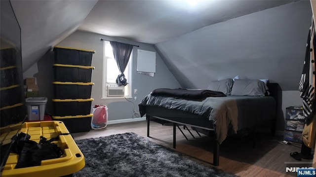 20 2nd Ave, Paterson, NJ 07524 - bedroom featuring wood finished floors, vaulted ceiling, and cooling unit