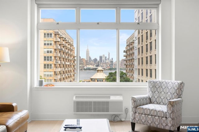 1400 Hudson St Unit 730, Hoboken, NJ 07030 - sitting room with a skyline view and a wall mounted AC
