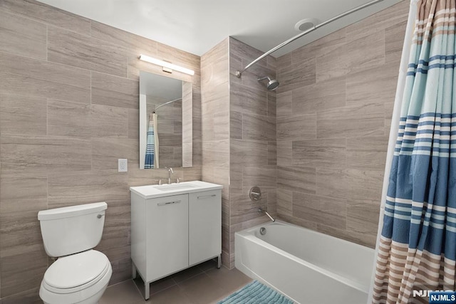 1400 Hudson St Unit 730, Hoboken, NJ 07030 - full bath featuring shower / bath combination with curtain, vanity, tile patterned floors, and tile walls
