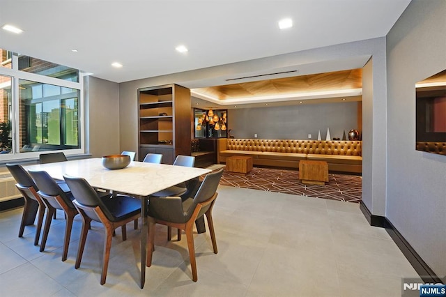 1400 Hudson St Unit 730, Hoboken, NJ 07030 - tiled dining space featuring a tray ceiling and recessed lighting