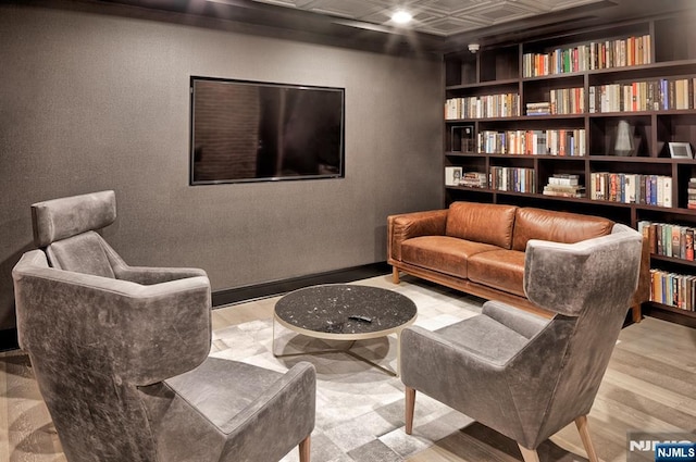 1400 Hudson St Unit 730, Hoboken, NJ 07030 - living area with an ornate ceiling, wood finished floors, and built in shelves