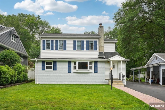4 Lenape Trl, Wayne, NJ 07470 - view of front facade with a chimney, a front lawn, asphalt driveway, and brick siding