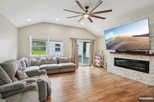 4 Lenape Trl, Wayne, NJ 07470 - living area featuring vaulted ceiling, ceiling fan, wood finished floors, a stone fireplace, and recessed lighting