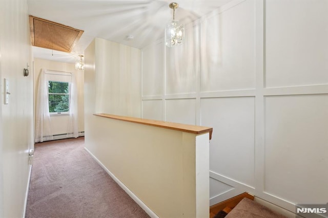 4 Lenape Trl, Wayne, NJ 07470 - hall with attic access, a baseboard radiator, carpet flooring, baseboards, and an upstairs landing