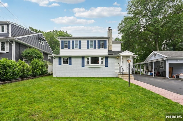 4 Lenape Trl, Wayne, NJ 07470 - view of front of property with a chimney, a front lawn, and brick siding