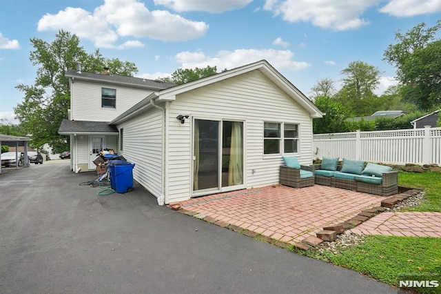4 Lenape Trl, Wayne, NJ 07470 - rear view of property featuring a patio and outdoor lounge area