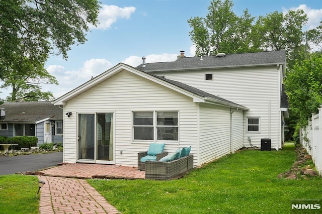 4 Lenape Trl, Wayne, NJ 07470 - back of property with a yard, a patio area, central AC unit, and roof with shingles