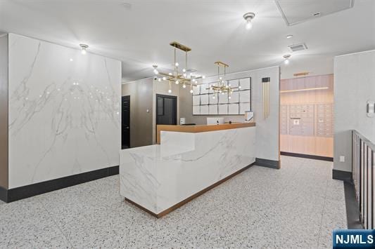 7400 River Rd Unit 120, North Bergen, NJ 07047 - reception with a chandelier