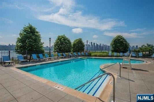 7400 River Rd Unit 120, North Bergen, NJ 07047 - community pool with a patio area