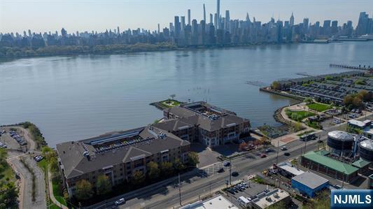 7400 River Rd Unit 120, North Bergen, NJ 07047 - drone / aerial view of a large body of water and skyline