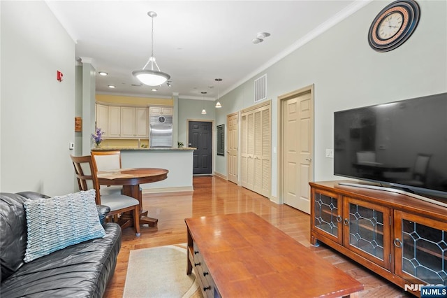 7400 River Rd Unit 120, North Bergen, NJ 07047 - living area with ornamental molding and light wood finished floors