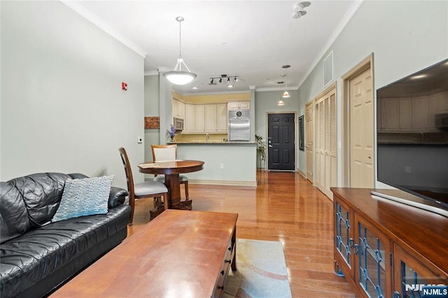 7400 River Rd Unit 120, North Bergen, NJ 07047 - living room featuring ornamental molding and light wood-style floors