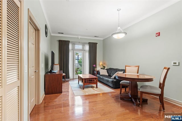 7400 River Rd Unit 120, North Bergen, NJ 07047 - living room featuring wood finished floors and crown molding