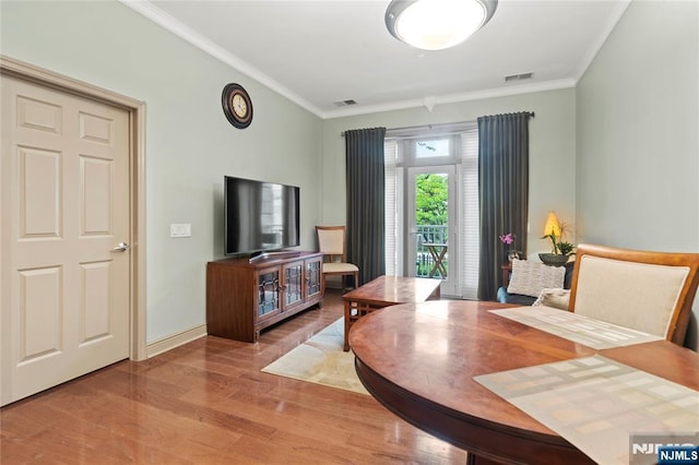 7400 River Rd Unit 120, North Bergen, NJ 07047 - dining space featuring wood finished floors and ornamental molding