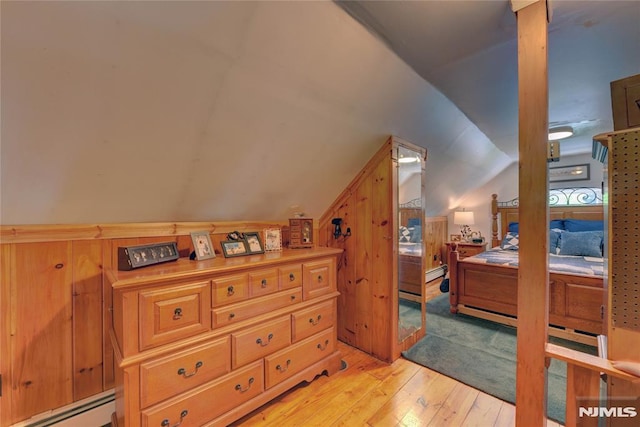21 Bartholdi Ave, Wanaque, NJ 07420 - bedroom featuring a baseboard radiator, light wood finished floors, and vaulted ceiling