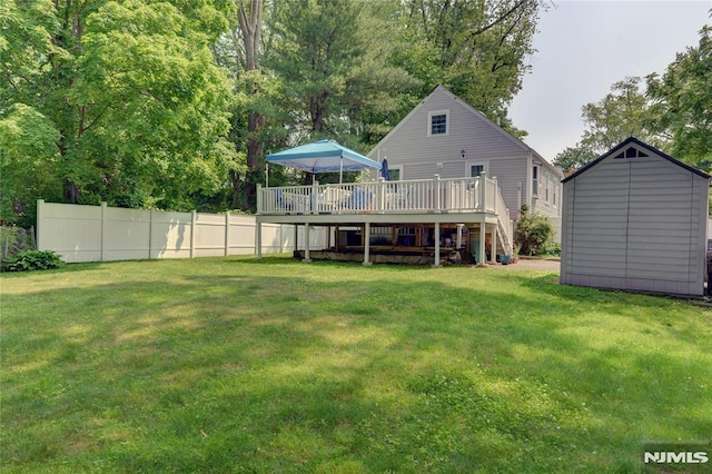 21 Bartholdi Ave, Wanaque, NJ 07420 - back of property with a wooden deck, a storage shed, and stairway