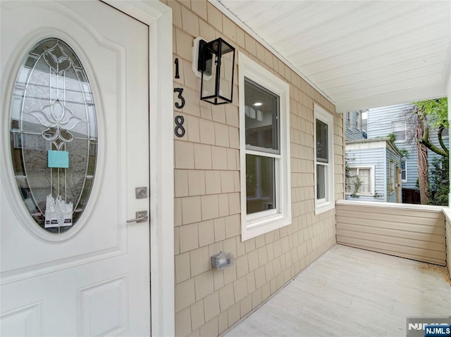 138 Willow St, Bloomfield, NJ 07003 - doorway to property with a porch