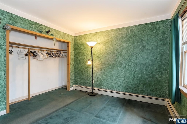 149 Springfield Ave, Rutherford, NJ 07070 - unfurnished bedroom featuring a baseboard heating unit and carpet flooring