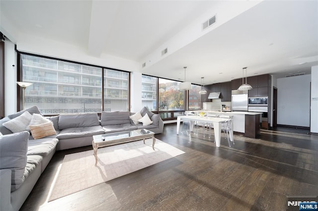 9 Somerset Ln Unit 201, Edgewater, NJ 07020 - living room featuring dark wood-type flooring