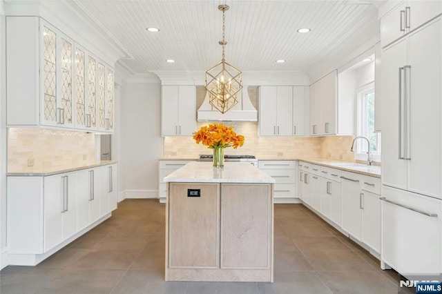 333 Mill Rd, Saddle River, NJ 07458 - kitchen featuring a kitchen island, tile patterned flooring, recessed lighting, paneled fridge, and backsplash