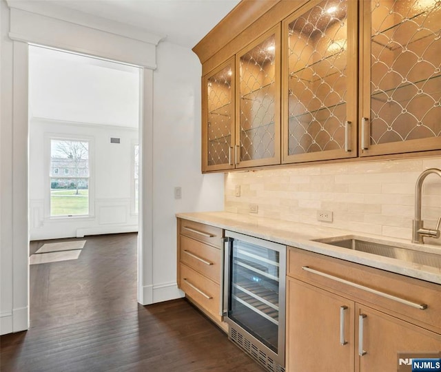 333 Mill Rd, Saddle River, NJ 07458 - indoor dry bar featuring beverage cooler, decorative backsplash, and dark wood-style flooring