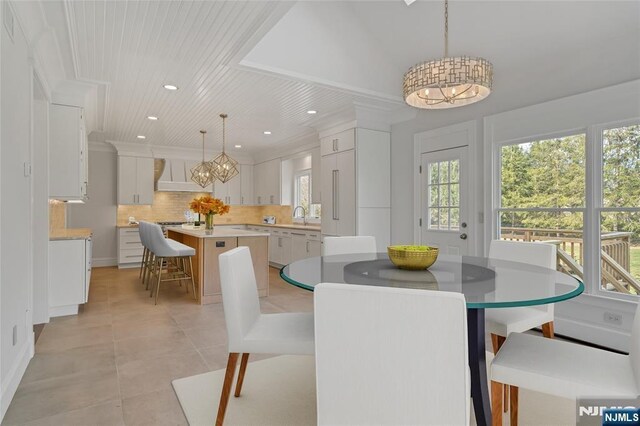 333 Mill Rd, Saddle River, NJ 07458 - dining area with a chandelier, light tile patterned floors, recessed lighting, and wooden ceiling