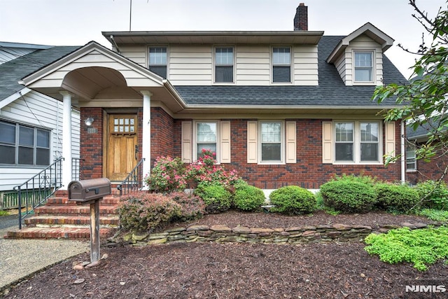123 Buena Vista Ave, Hawthorne, NJ 07506 - view of front of home with brick siding, a chimney, and a shingled roof