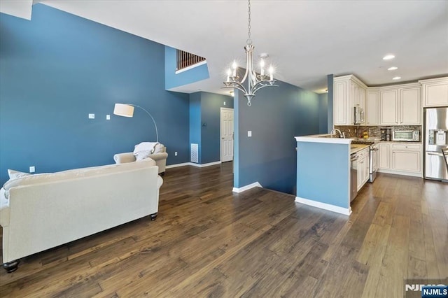 73 Autumn Way Unit 24, Montvale, NJ 07645 - kitchen with stainless steel appliances, open floor plan, a chandelier, recessed lighting, and backsplash