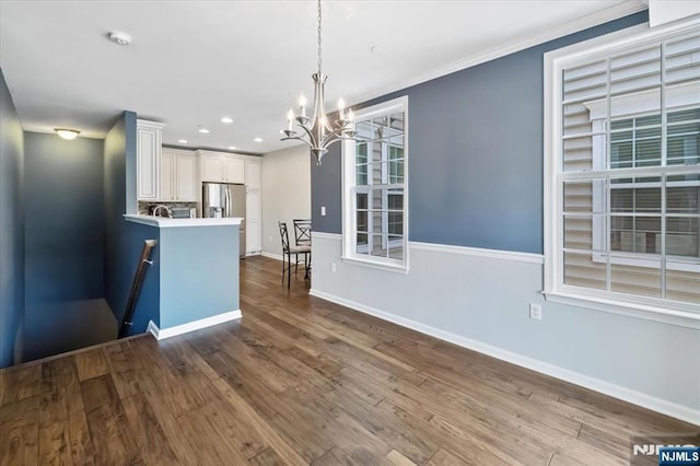 73 Autumn Way Unit 24, Montvale, NJ 07645 - kitchen with stainless steel fridge with ice dispenser, a chandelier, white cabinetry, hanging light fixtures, and dark wood-type flooring