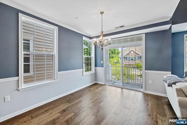 73 Autumn Way Unit 24, Montvale, NJ 07645 - unfurnished dining area featuring a chandelier, wood-type flooring, and ornamental molding