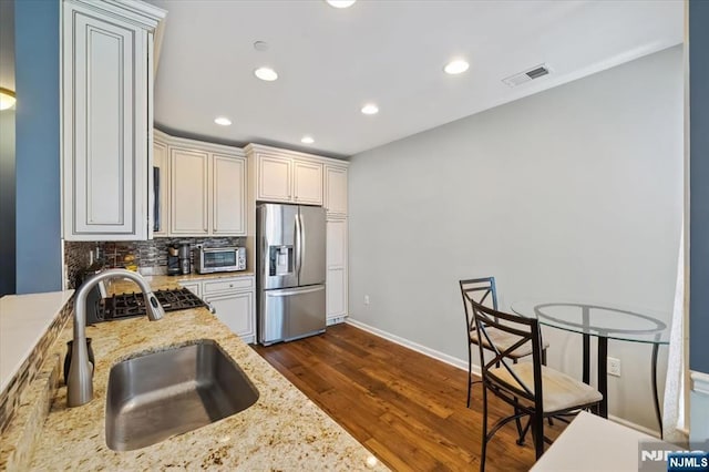 73 Autumn Way Unit 24, Montvale, NJ 07645 - kitchen featuring stainless steel fridge, tasteful backsplash, dark wood-style floors, light stone counters, and recessed lighting