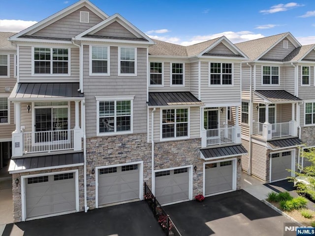 73 Autumn Way Unit 24, Montvale, NJ 07645 - multi unit property featuring a standing seam roof, driveway, and stone siding