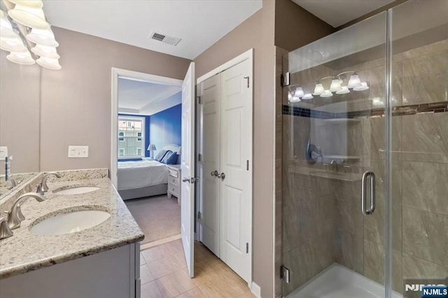 73 Autumn Way Unit 24, Montvale, NJ 07645 - bathroom featuring ensuite bathroom, double vanity, and a stall shower