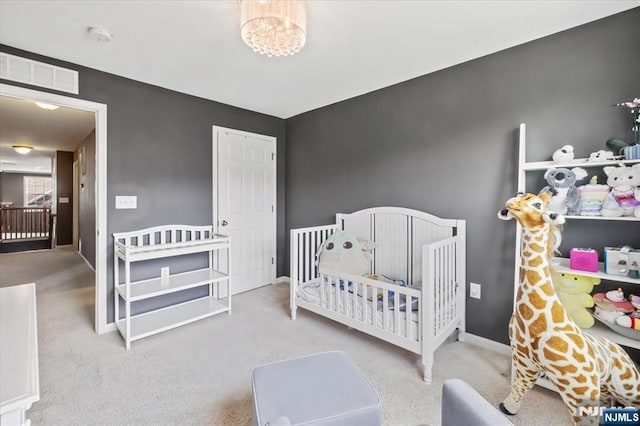 73 Autumn Way Unit 24, Montvale, NJ 07645 - carpeted bedroom featuring a crib and baseboards