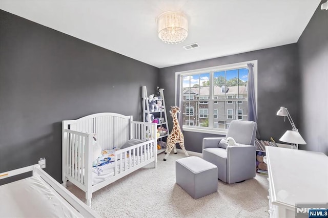 73 Autumn Way Unit 24, Montvale, NJ 07645 - carpeted bedroom with a nursery area and a chandelier