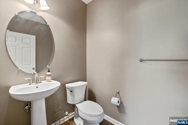 73 Autumn Way Unit 24, Montvale, NJ 07645 - half bathroom featuring toilet and wood finished floors
